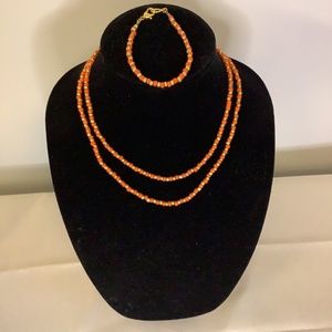 Orange and gold tone necklace with bracelet